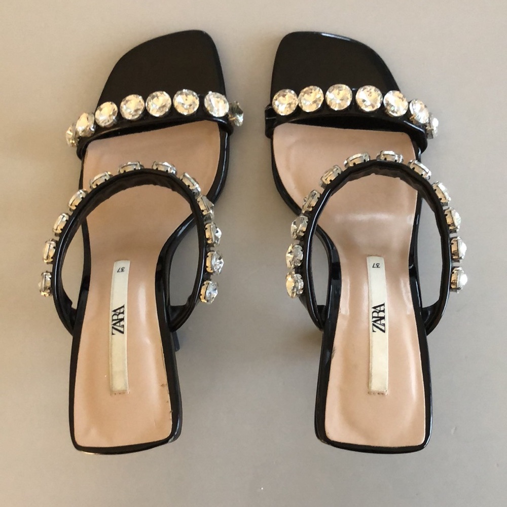 Black sandals with crystal embellishments